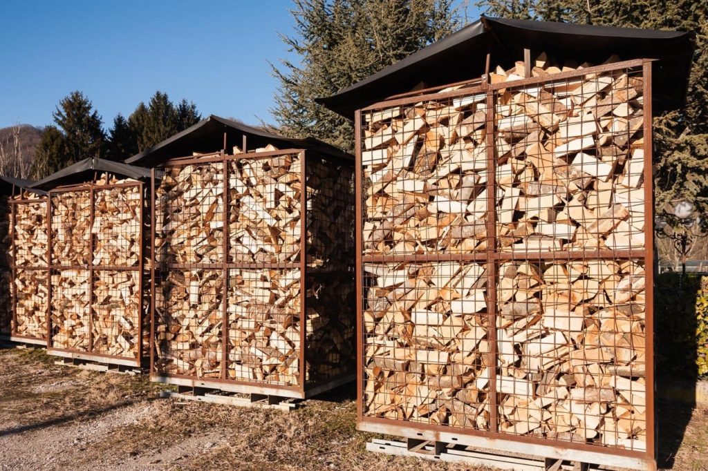 Firewood on pallets with cages